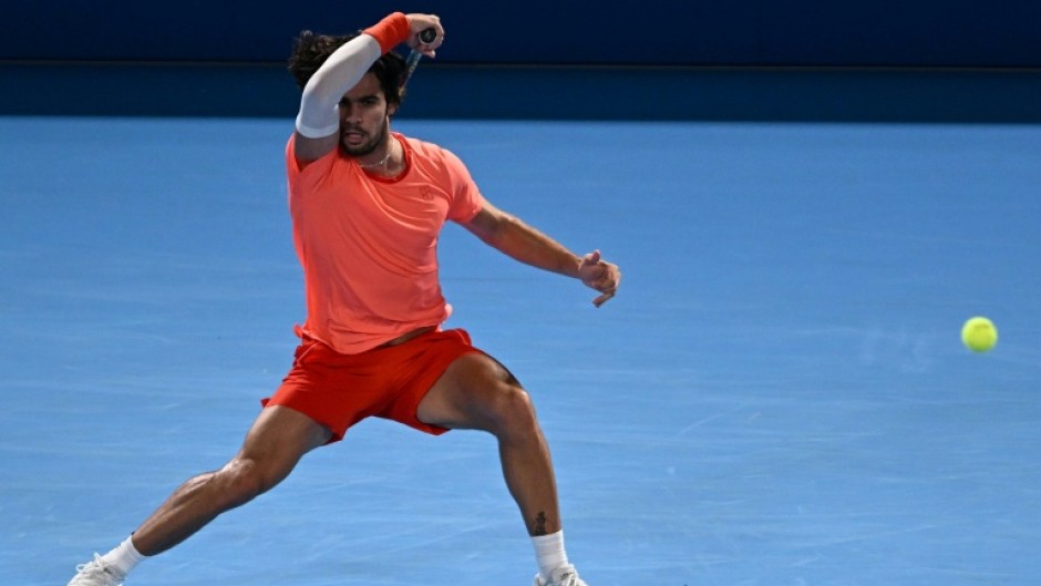 Spain's Carlos Alcaraz plays a shot to USA's Alex Michelsen during their men's singles tennis match at the ATP Tour Japan Open Tennis Championships at the Ariake Tennis Forest Park in Tokyo on October 1, 2026.