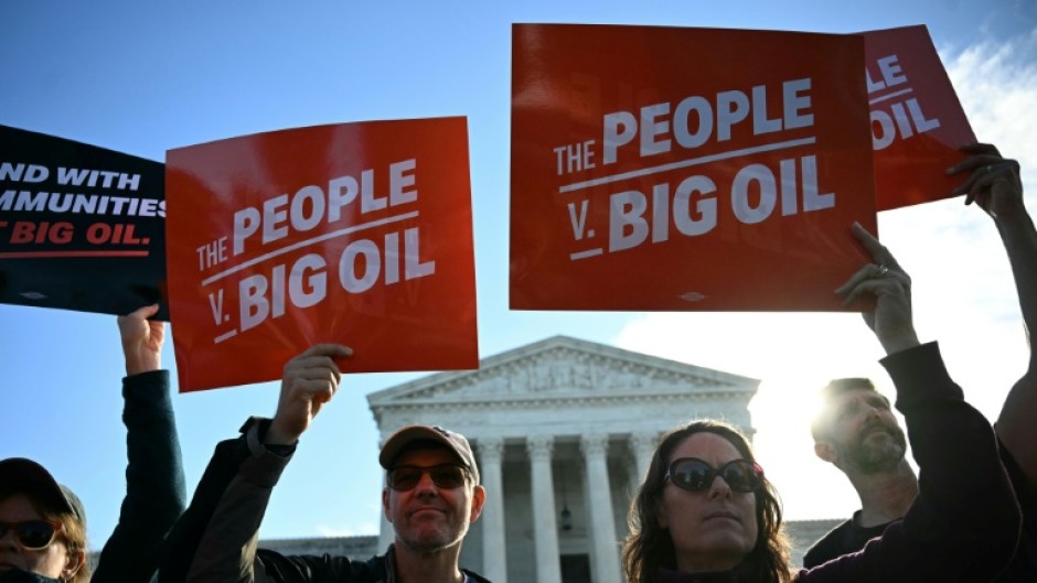 Protestors outside the US Supreme as it hears a major climate case