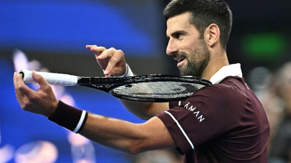 Serbia's Novak Djokovic celebrates his victory over Germany’s Alexander Zverev during their men’s singles quarter-final at the China Open tennis tournament in Beijing on October 4, 2026.