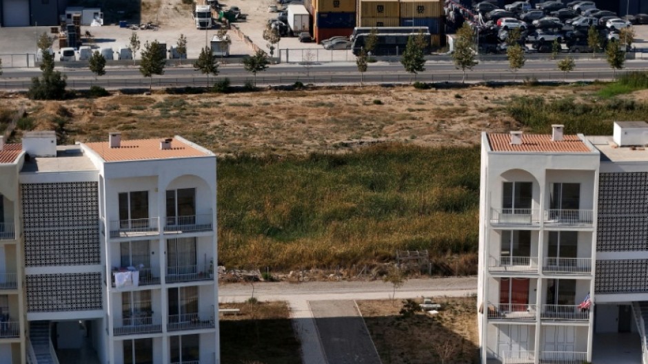 The stacked containers of toxic waste have been stored close to homes