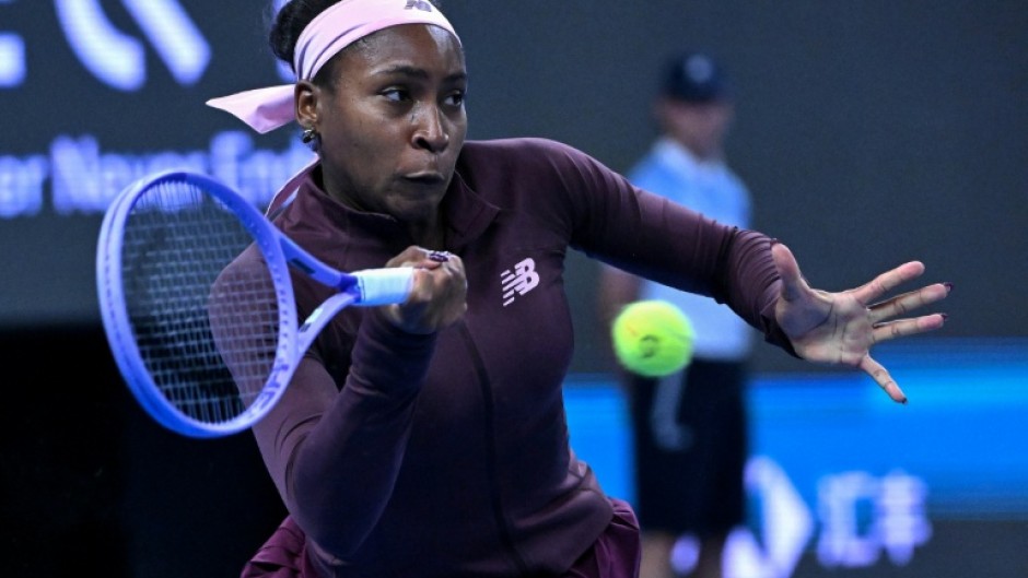 US player Coco Gauff hits a return to China's Sun Xinran during their singles match at the China Open in Beijing