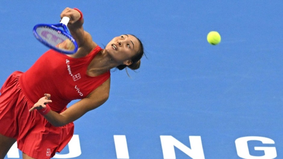 China’s Zheng Qinwen serves to Russia’s Mirra Andreeva