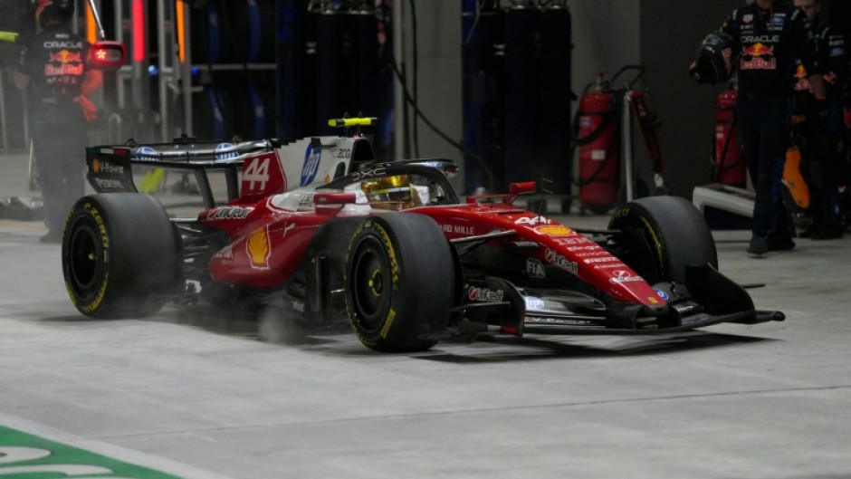Ferrari's British driver Lewis Hamilton in the pit lane during the Singapore Grand Prix