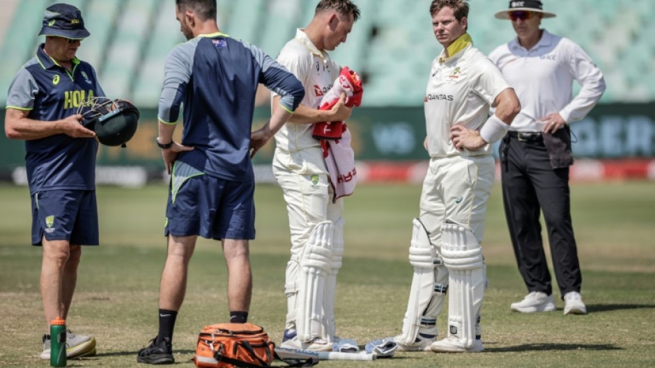 Steve Smith was assessed after being struck on the helmet by Anrich Nortje