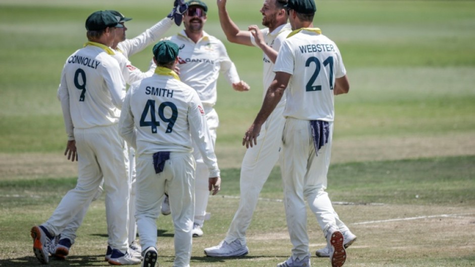 Australia's Josh Hazlewood (2nd R) celebrates taking Wiaan Mulder's wicket on day five
