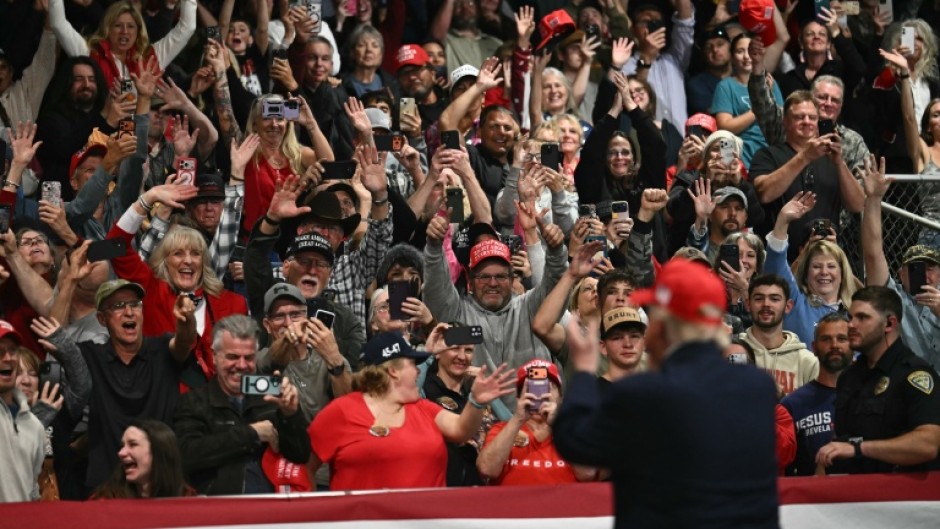 Supporters cheer US President Donald Trump at a rally in Kalispell, Montana, on stop in a campaign tour ahead of November 3 midterm elections