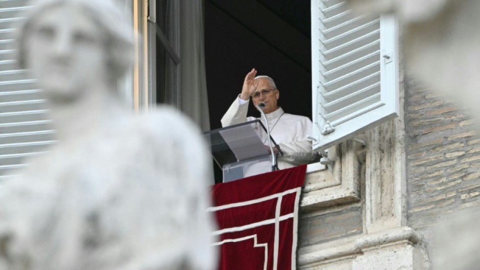 Resolved to resume working "gradually" after surgery, the pope blesses the crowd from the window of the apostolic palace overlooking St. Peter's square