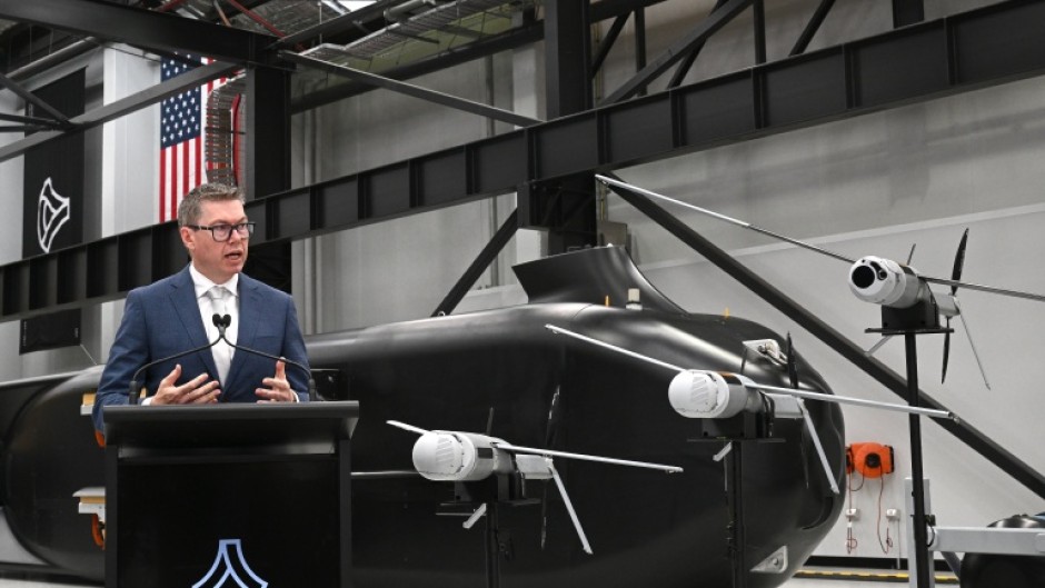 Australia's Minister for Defence Industry, Pat Conroy, speaks to the media in front of the autonomous undersea vehicle Ghost Shark at an Anduril facility in Sydney on October 19, 2026