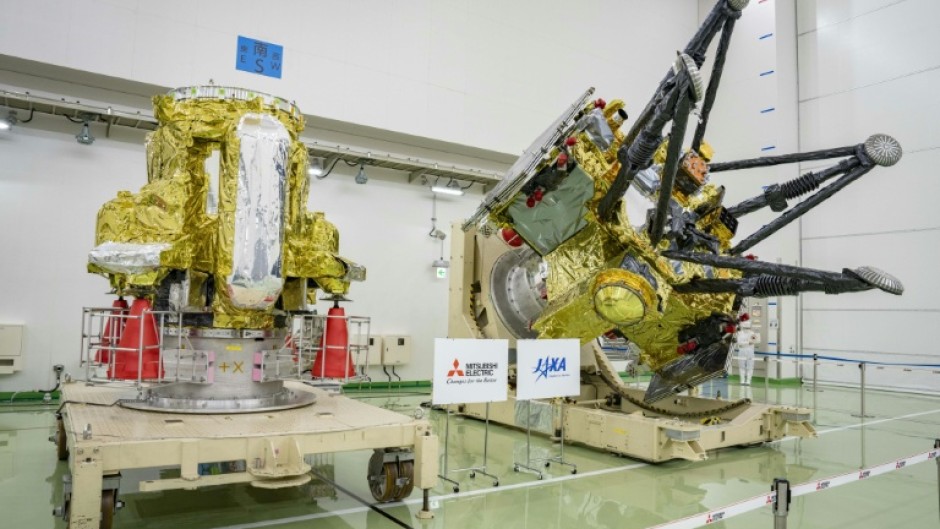 Two modules that make up the Martian Moons eXploration (MMX) spacecraft, which launched on October 20, 2026, are seen at the Tanegashima Space Center in Japan's Kagoshima prefecture two months prior to the launch