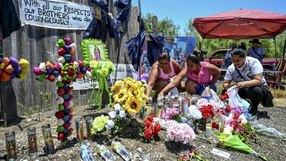 A makeshift memorial to migrants who died in a tractor-trailer outside San Antonio, Texas, in June 2022