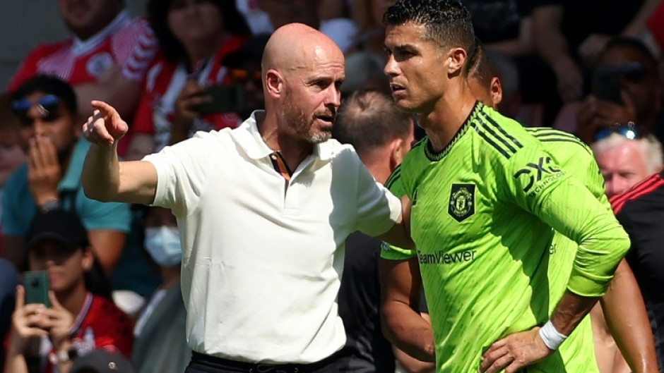 Former Manchester United manager Erik ten Hag speaking to Cristiano Ronaldo