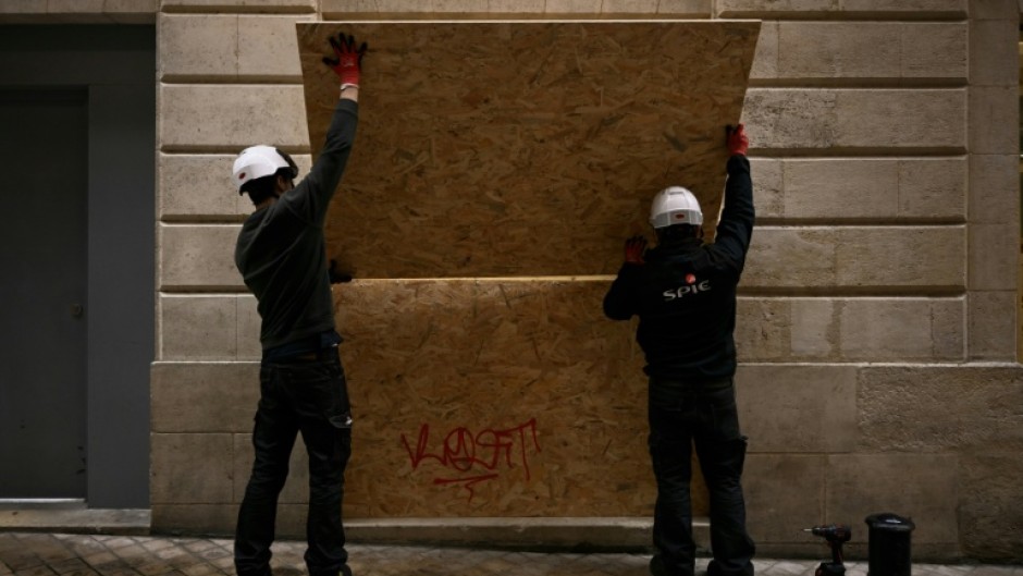 Shops in French city centres are boarding their windows ahead of fresh protests planned this weekend, fearing further unrest