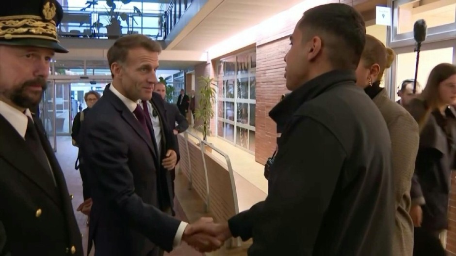 Macron visits town near Paris after deadly shooting