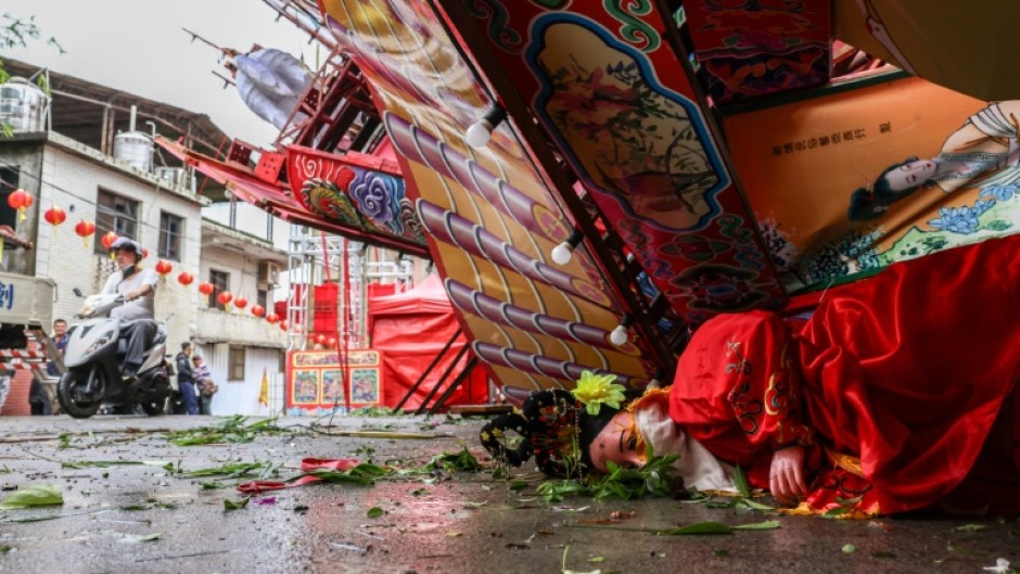 Typhoon Champi dumped heavy rain, toppled trees and knocked out power to thousands of homes