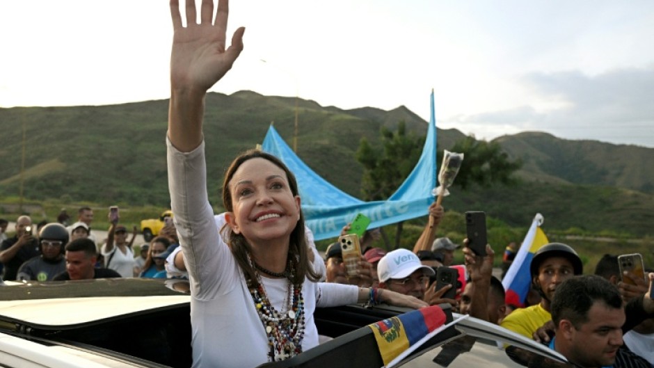 Venezuelan opposition leader and Nobel Peace Prize laureate Maria Corina Machado greets supporters after her return from exile to her homeland