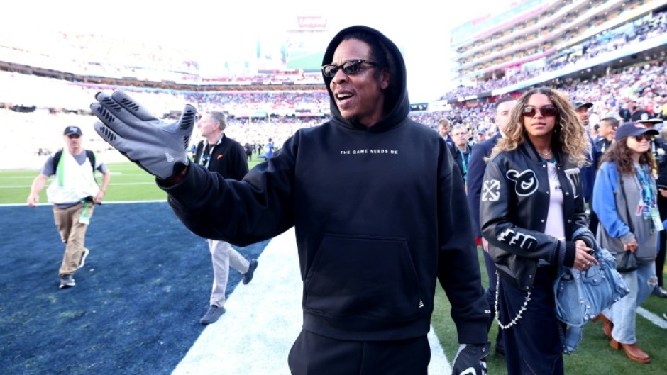 Rapper Jay-Z, shown on the sideline at last season's Super Bowl, will serve as the halftime musical performer at next February's Super Bowl in Los Angeles, the NFL announced