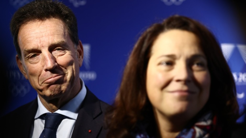 Geoffroy Roux de Bezieux (L) alongside France's Sports Minister Marina Ferrari