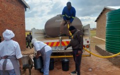 File: Water tankers supplying water to residents. eNCA