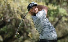 Top-ranked Jon Rahm of Spain lost his match but won his group Friday at the WGC Match Play, advancing to a Saturday knockout showdown against four-time major winner Brooks Koepka