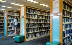 A women looks at books in a public library in Hong Kong