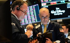 The greenback held gains against most currencies after a blowout in swap spreads showed investors are facing a shortage of dollars as equity markets plunged on fears about the economic impact of the flu-like virus.