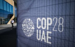 A man walks past a COP28 sign at the venue of the United Nations climate summit in Dubai. AFP/Jewel Samad