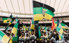 Supporters of the African National Congress (ANC) wave flags during the Election Manifesto launch. AFP/Rajesh Jantilal