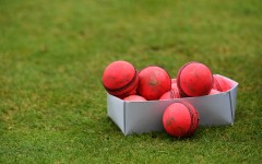 File: A box of used pink cricket balls are pictured on a pitch. AFP/Paul Ellis
