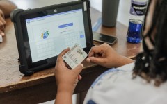 An IEC official checks an ID. AFP/Rajesh Jantilal