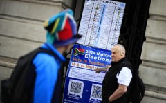 A person points at a poster outside the South African High Commission in central London. AFP/Benjamin Cremel