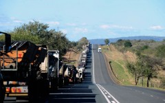 File: A line of trucks along the N4 highway. Leon Sadiki/Bloomberg via Getty Images