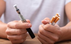 File: A man holding an e-cigarette vape cigarettes. Getty Images/Andrey Popov