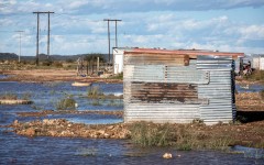File: A flooded shack stands abandoned. Per-Anders Pettersson/Getty Images