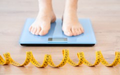 File: A person standing on a scale. Weight loss. GettyImages/Cunaplus_M.Faba