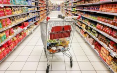 File: A shopping cart in the middle of a section of canned and dried products. Nicolas Guyonnet/Hans Lucas via AFP
