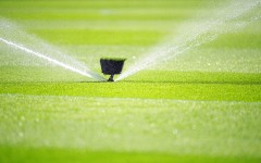 File: A water sprinkler spraying water. Michael Kappeler/dpa Picture-Alliance via AFP