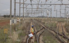 A worker prepares to signal on the train tracks on the central corridor rail freight line. Guillem Sartorio/Bloomberg via Getty Images