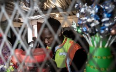A member of the National Consumer Commission (NCC) conducts an inspection on a spaza shop. AFP/Shiraaz Mohamed