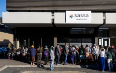 People queue outside the SASSA office to exchange SASSA cards for the new Postbank Black Cards. Gallo Images/Die Burger/Jaco Marais
