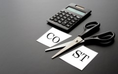 File: Cost-cutting with a calculator. GettyImages/takasuu