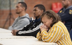 Kelly Smith and co-accused Steveno van Rhyn (C), and Jacquen Appollis. AFP/Rodger Bosch