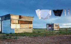 File: A school uniform hangs among shacks. GettyImages/Per-Anders Pettersson