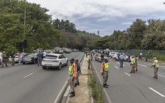 File: JMPD officers stop vehicles at a roadblock. AFP/Guillem Sartorio