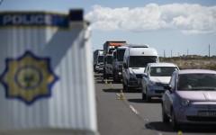 SAPS officers and traffic officials conduct a roadblock on a national highway. AFP/Rodger Bosch