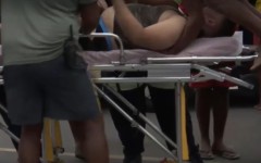 Image of male being rescued from a near-drowning experience at Baggies Beach in Durban.