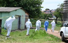 SAPS forensic teams examine a crime scene at Saulsville Hostel. Gallo Images/Frennie Shivambu