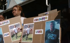 Community members protesting outside court.