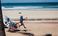 File: A rickshaw puller goes about his business with tourists on a ride at the North Beach. AFP/Rajesh Jantilal