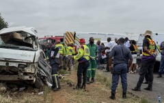 Rescue workers stand at the scene of the Vanderbijlpark accident. AFP/John Mkhize