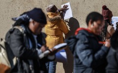 Unemployed people fill in the Department of Unemployment and Labour work seeking registration forms. AFP/Phill Magakoe
